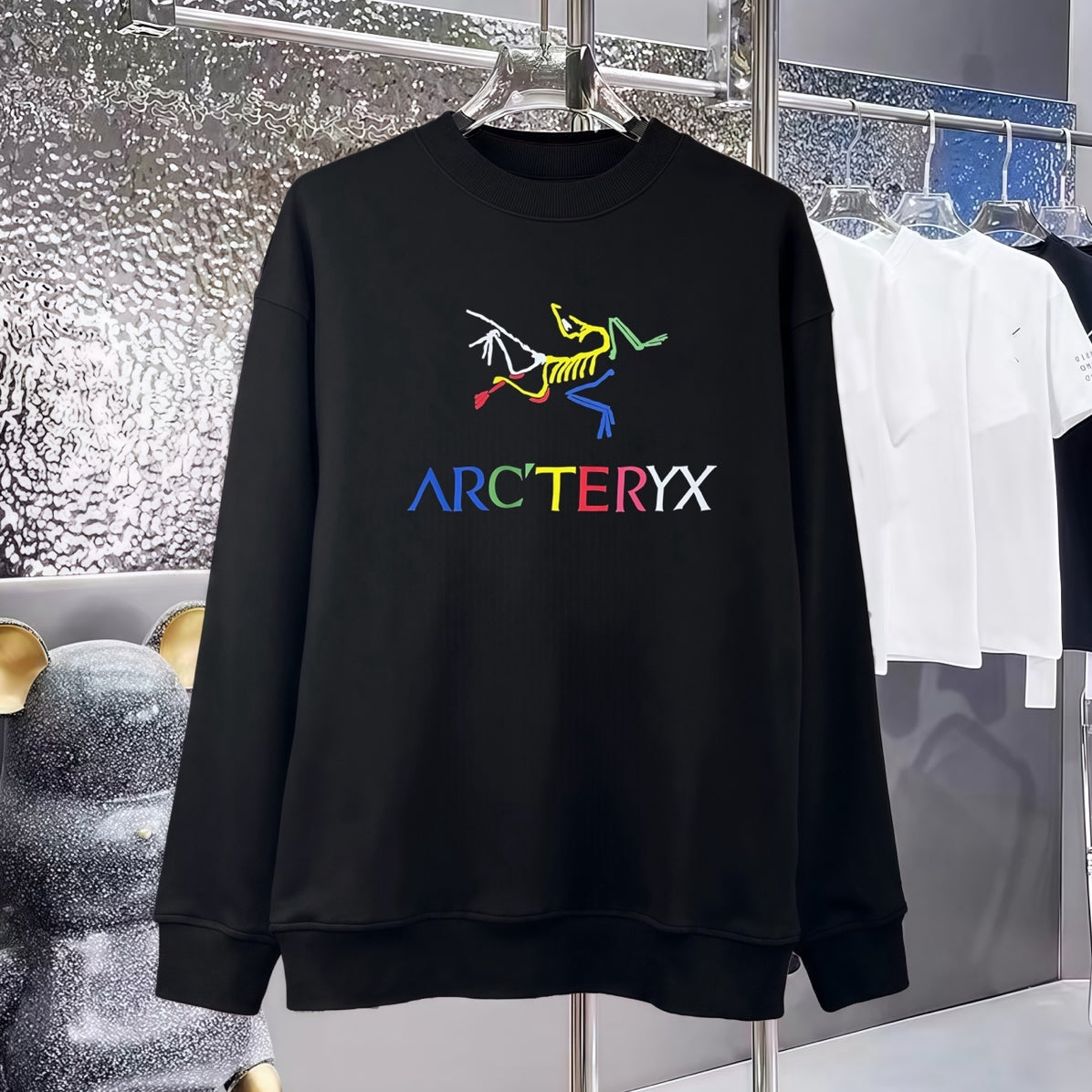 Black sweatshirt front with multicolor graphic